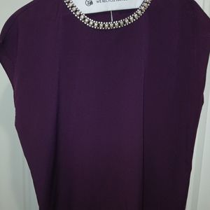 Top with rhinestone neckline.